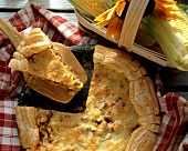 American sweetcorn quiche with mince, one piece raised