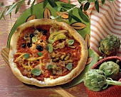 Pizza quattro stagioni with oregano leaves