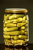 Glass of pickled gherkins
