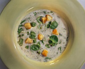 Creamy potato soup with watercress and croutons