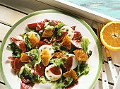 Warm salad leaves with beetroot, oranges & goat's cheese