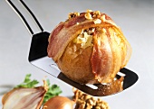 Apples stuffed with sauerkraut, with bacon slices & nuts 