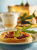 Fig tart with wine whip; green leaves