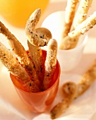 Spicy sticks sprinkled with coarse salt & caraway in tumblers 