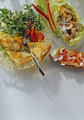 Potato omelette & rocket; tomatoes on bread; mushroom salad