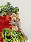 Pepper, chard, mushrooms & broccoli on chopping board