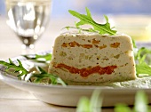 Vegetable terrine with asparagus mousse, with rocket garnish