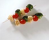 Two fish kebabs with cherry tomatoes & broccoli florets