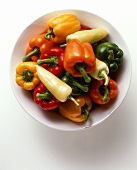 Mixed peppers with pointed pepper on white plate
