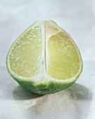A lime, cut in half lengthwise