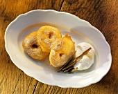 Apple fritters with sugar & vanilla ice cream on plate