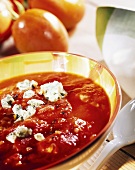 Tomato soup with Roquefort in coloured soup plate