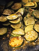 Fried courgettes in the pan (close-up)