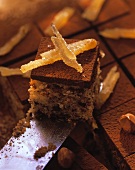 Chocolate & ginger squares with candied ginger on knife
