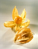 Two cape gooseberries (Physalis), one opened