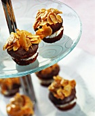 Bee-sting muffins topped with flaked almonds in honey