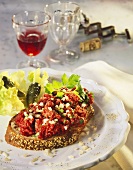 Open sandwich with tartare with onions & parsley on plate