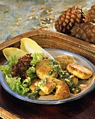 Tofu biscuits with oregano paste, pine nuts and salad