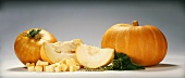 Two pumpkins, sliced and diced pumpkin