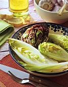 Grilled lettuce with spring onions in dish