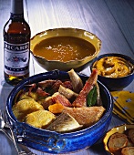Bouillabaisse in ceramic pot; sea urchin mayo; bread; pastis