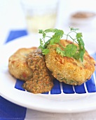 Fish cakes with sauce and fresh parsley
