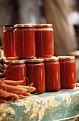 Tomato sauce in preserving jars at a market
