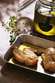 Roast rabbit pieces with a little olive oil in roasting dish