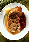 Roast stuffed goose roll with red cabbage and potato dumpling