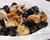 Dried figs and prunes on white plate