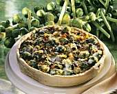 Whole Brussels sprout quiche with pumpkin seeds on large plate