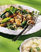 Spring vegetables with chervil and pine nuts on plate