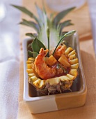Garlic shrimps with ketchup sauce in pineapple half