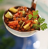 Lentil and vegetable soup on ladle