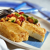 Breaded sheep's cheese with stir-fried vegetables