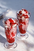 Two raspberry sundaes with meringue and raspberry sauce