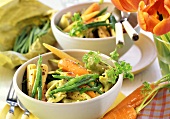 Primavera vegetables with tortellini in two bowls