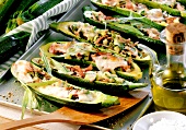 Courgettes stuffed with ham and tarragon on baking sheet