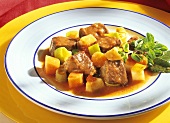 Beef with vegetables on a plate