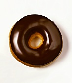 Doughnut with chocolate icing on white background