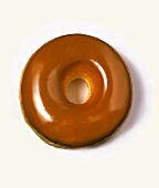 A doughnut with caramel frosting
