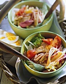 Salad leaves with turkey, sausage, cheese and tomatoes