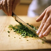 Chopping parsley with a knife