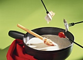 Fontina fondue in cast-iron pot