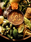 Vegetables with chili mince sauce in a shallow basket