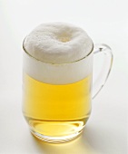 Light beer in a glass with a handle