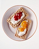 Two crisp breads with quark and jam