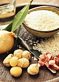 Still life with short-grain rice, chestnuts, bacon & onion