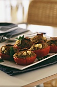 Baked stuffed tomatoes on white tray
