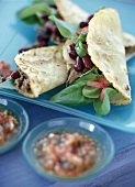 Tortillas with beans and beef; salsa